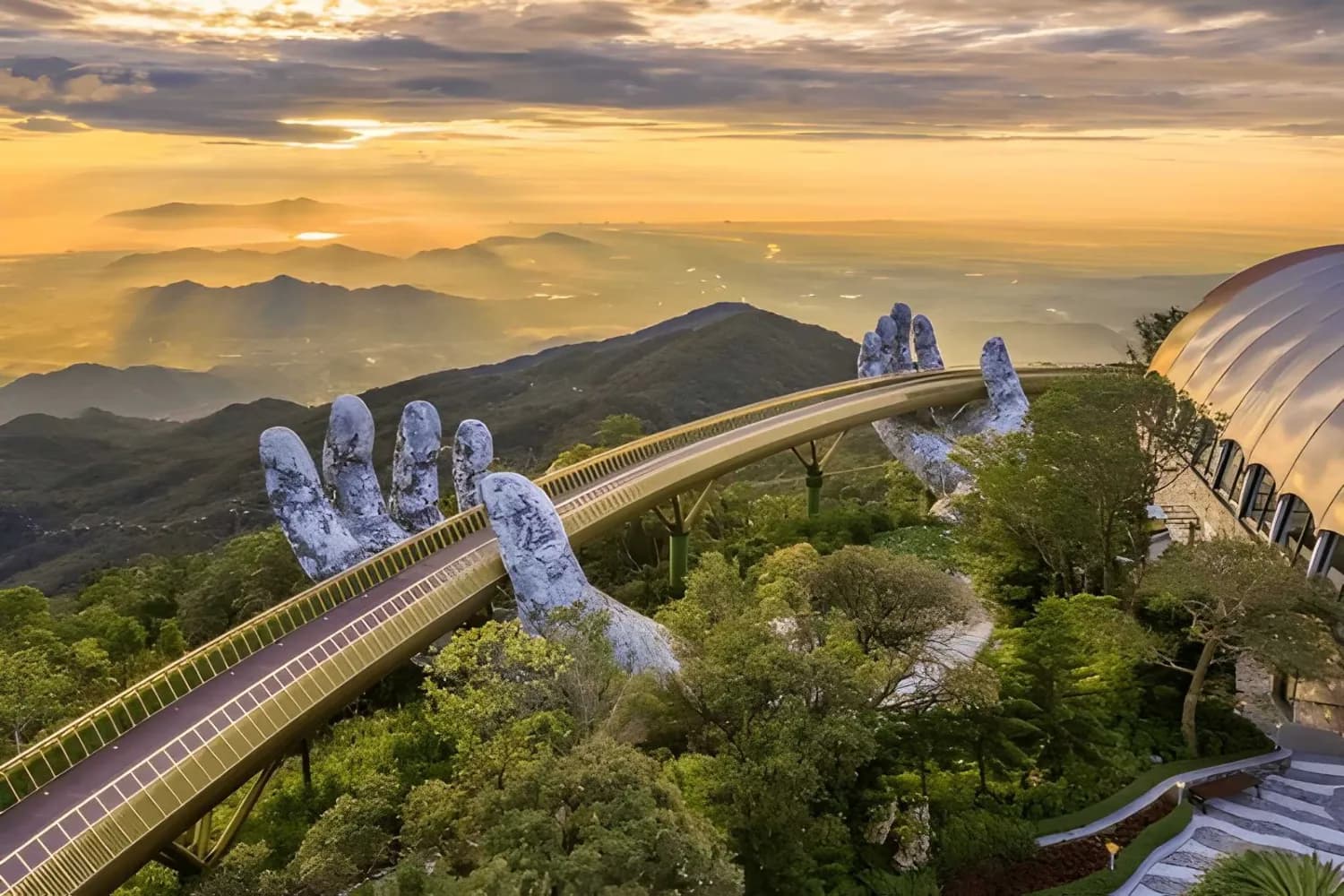 Aerial view of the Golden Bridge is lifted by two giant hands on Ba Na Hill in Da Nang