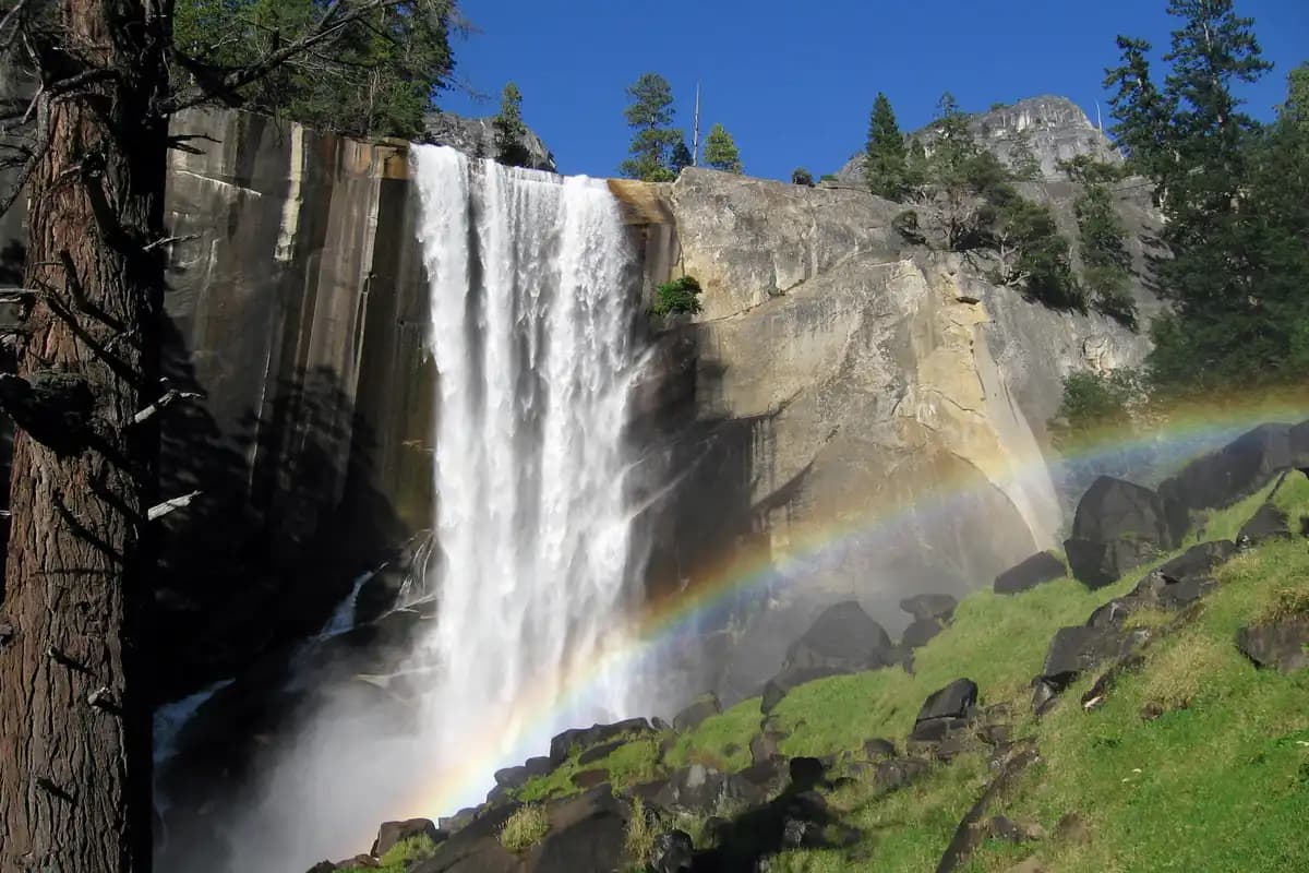 Rainbow-Waterfall-with-rocky-cliffs
