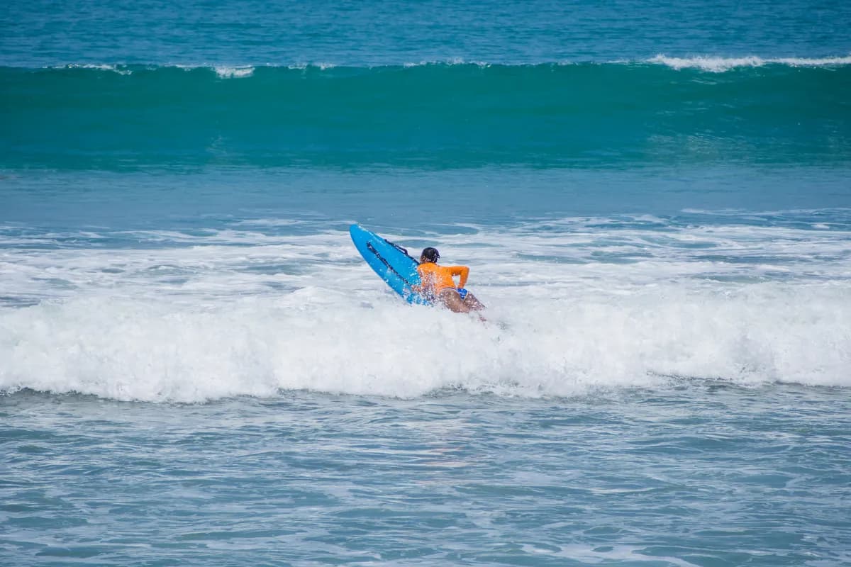 Surfer Surfing in Kuta Bali Indonesia