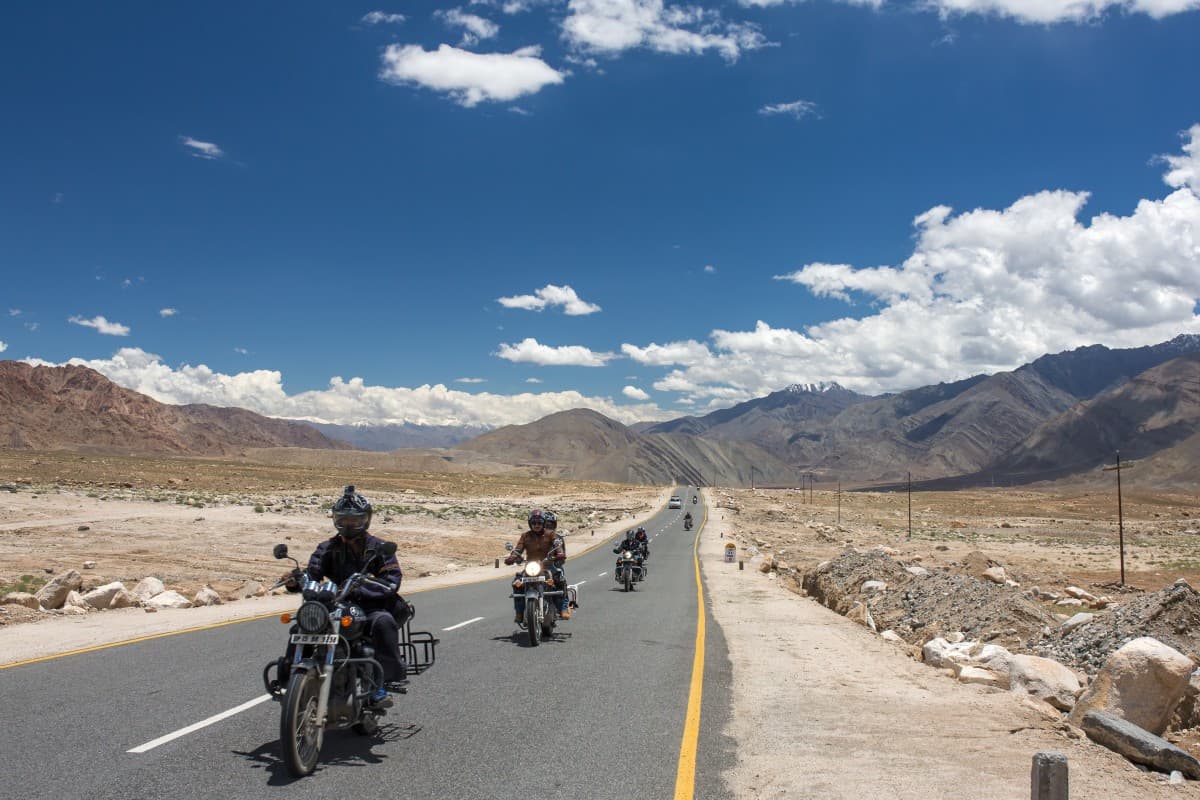 Riders Ride bike in Ladakh Mountains