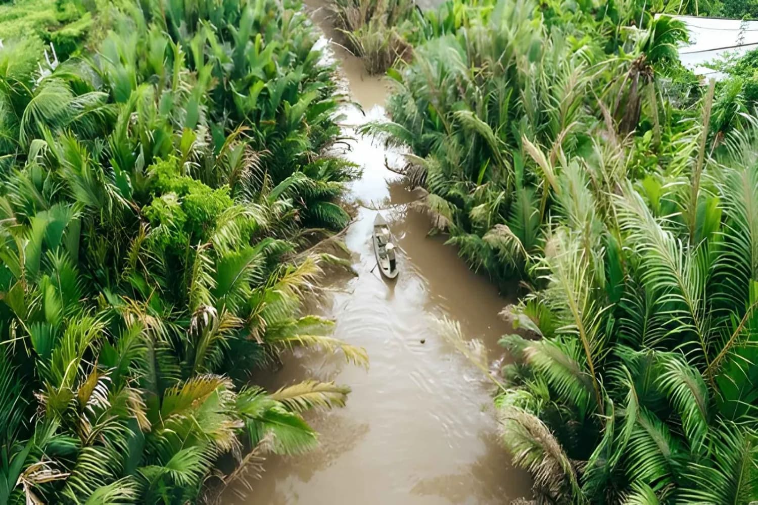 Aerial view from above of tourist on sampan boat in brown mekong river