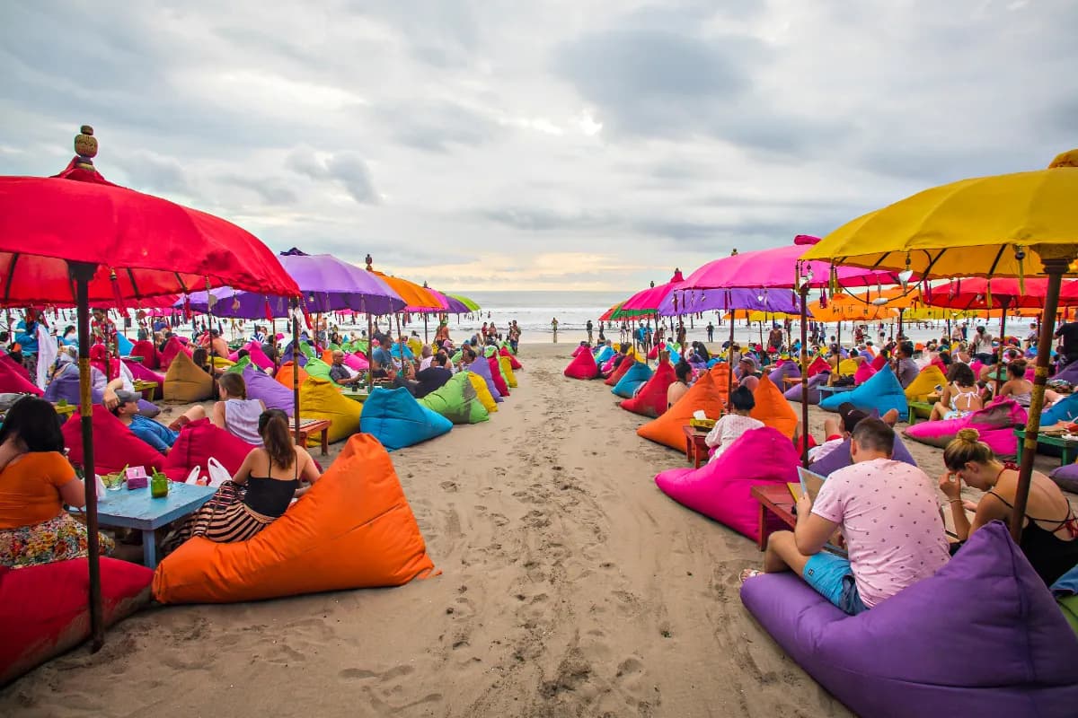 Tourist enjoying colourful Seminyak Beach