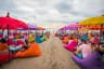 Tourist enjoying colourful Seminyak Beach