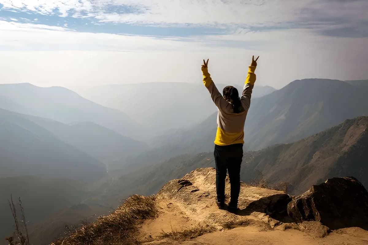 girl watching the beautiful mountain range from shillong Peak