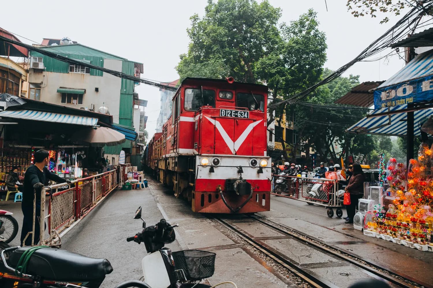 train on railway and people in Hanoi Vietnam