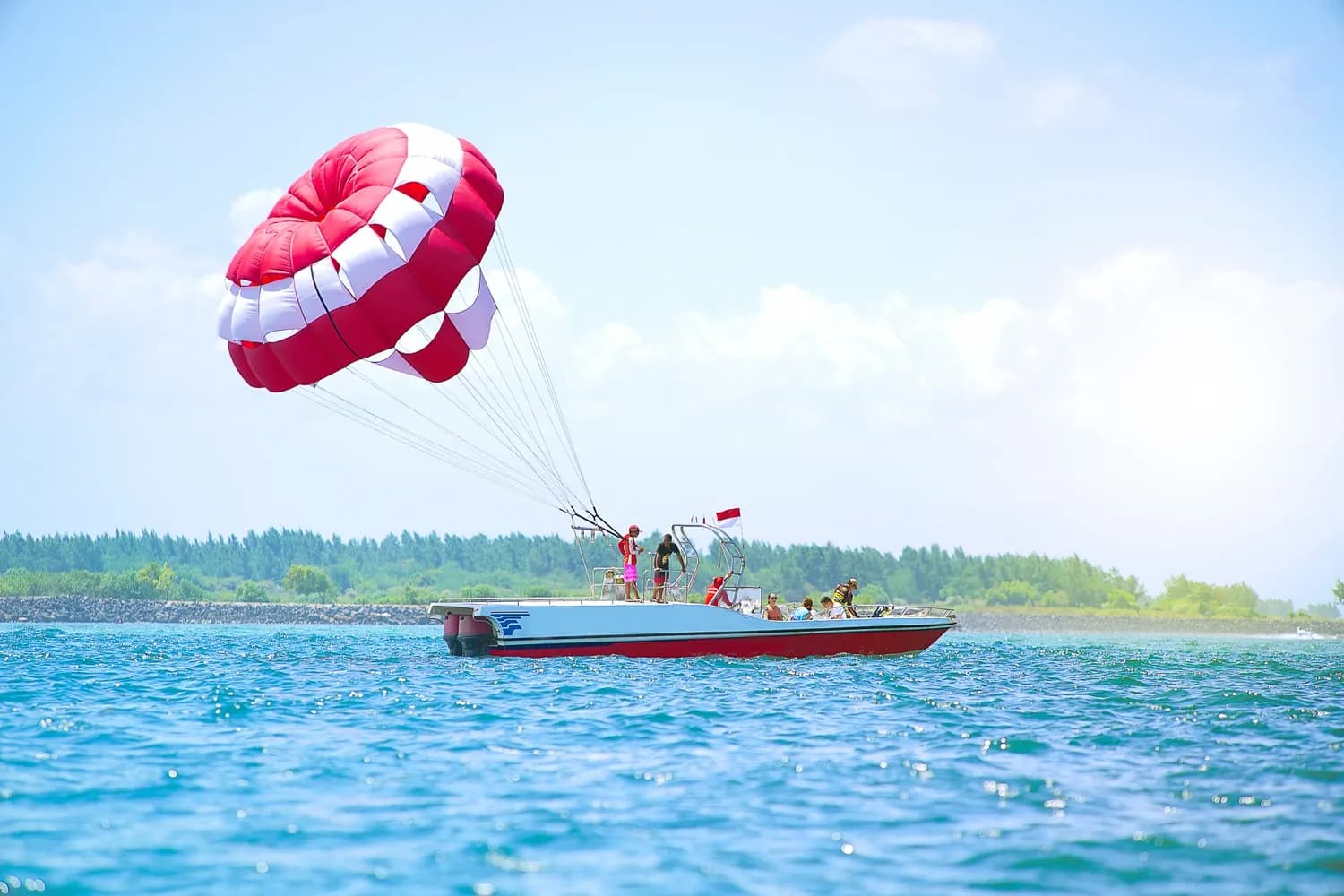 Tourist Enjoying Parasailing in Bali