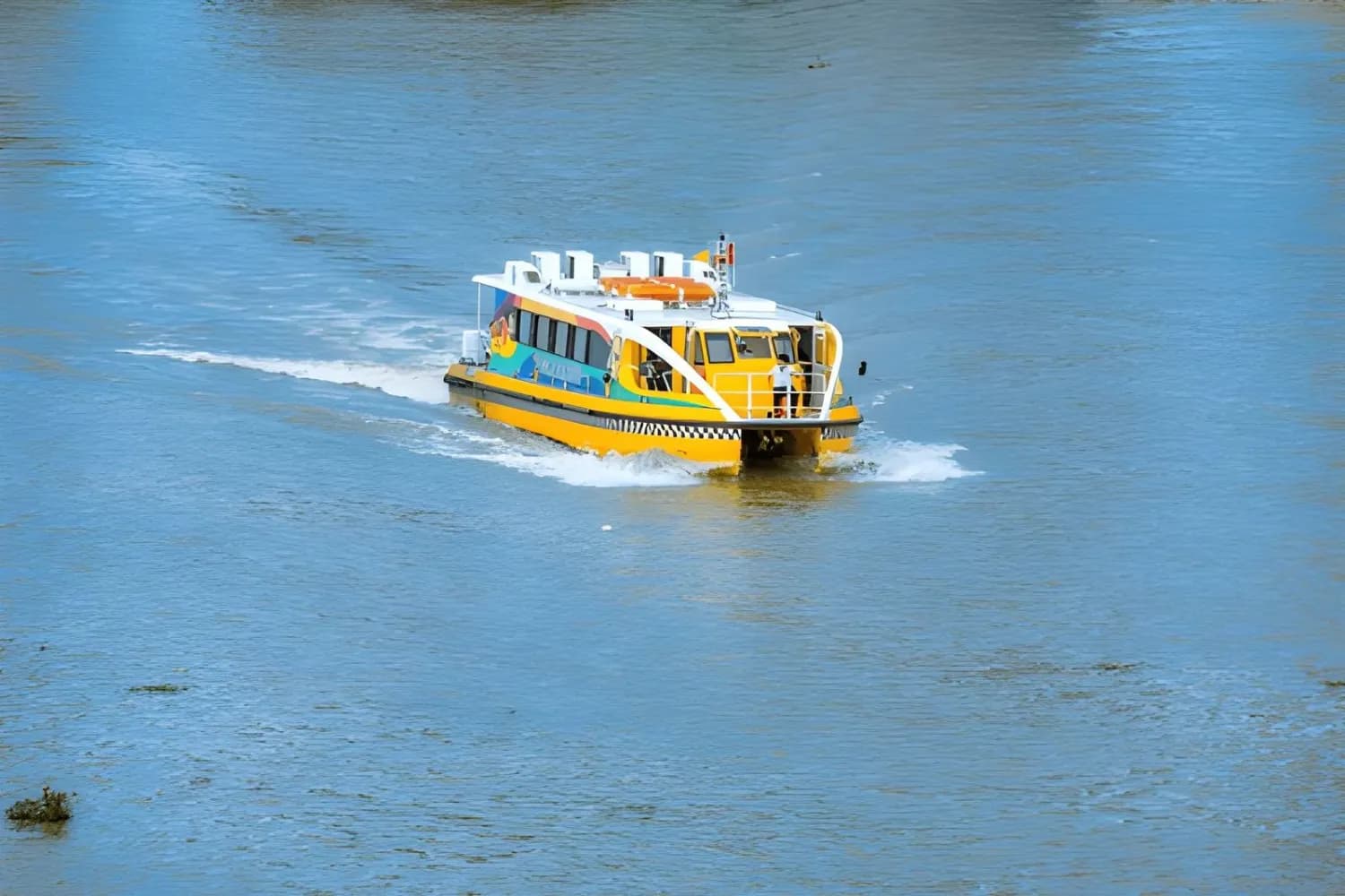 Saigon water-bus on the Saigon river and center of Ho Chi Minh city