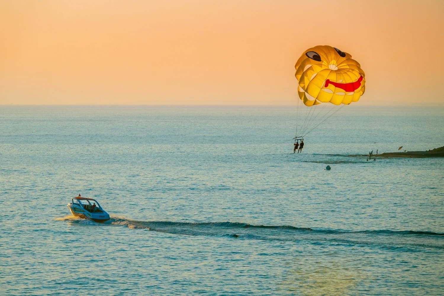 tourist enjoying parasailing at the Bali beach